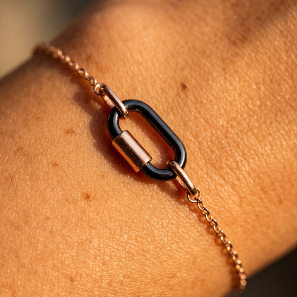 Hand holds blue sapphire; above, emeralds and diamonds lined up. Next to it, caliper and tool for weighing stones. 